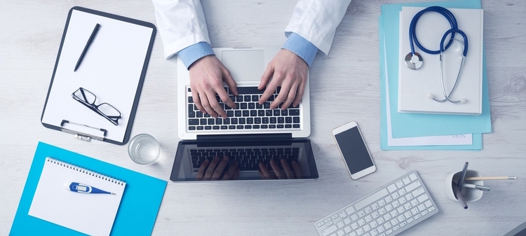 Physician Completing Medical Records