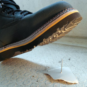 boot about to step on nail