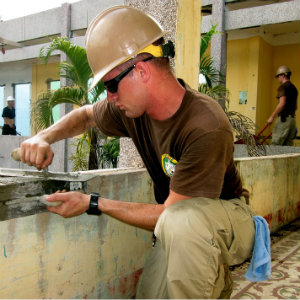 cement mason laying concrete