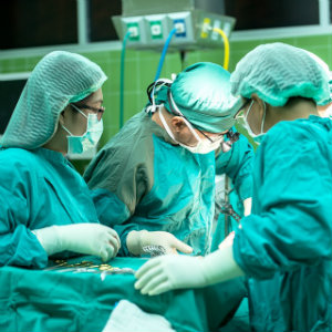 group of surgeons operating