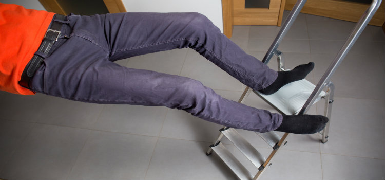 man falling from step ladder