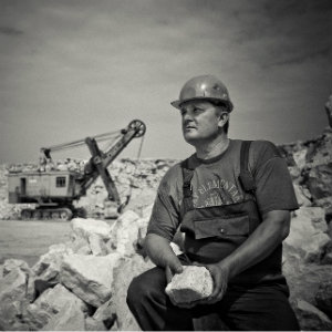 man holding rock hard hat