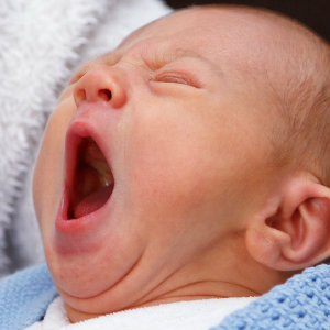 newborn baby yawning