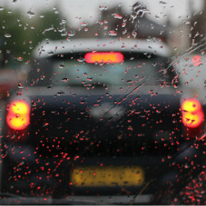rainy windshield view of car