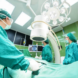 surgeons working on a patient