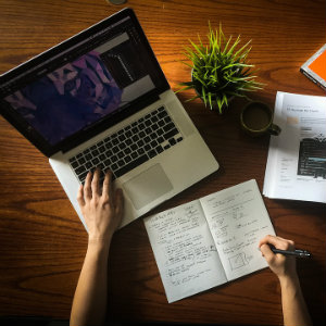 workspace with computer and books